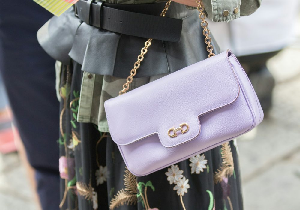 Model wears a purple purse